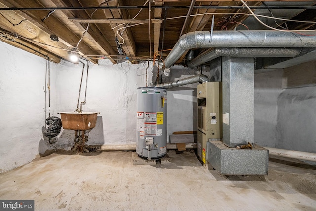 utility room featuring sink and gas water heater