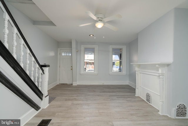 entryway with light wood-type flooring and ceiling fan