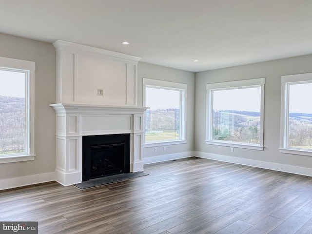 unfurnished living room with hardwood / wood-style floors