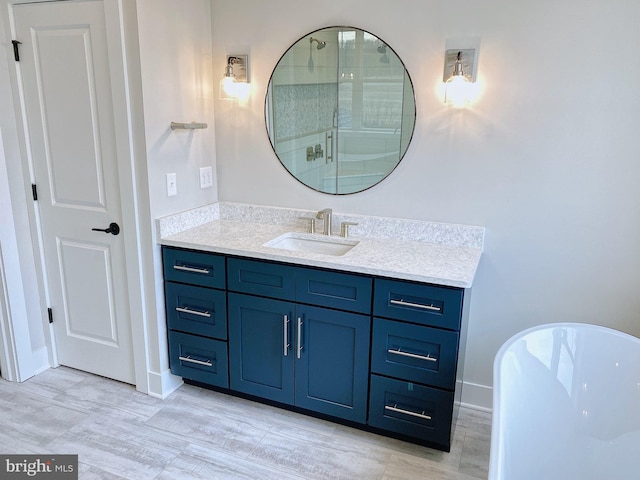 bathroom with vanity, separate shower and tub, and hardwood / wood-style flooring