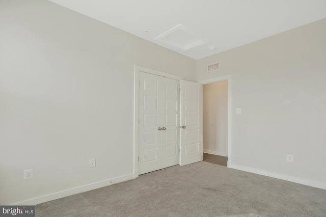 unfurnished bedroom with light carpet