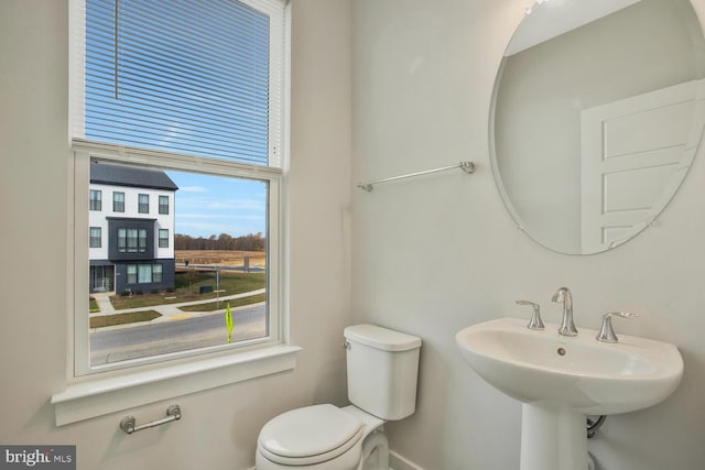 bathroom featuring sink and toilet