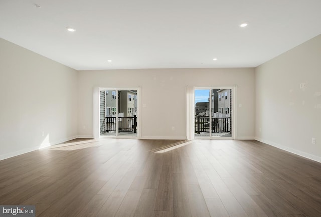 unfurnished room featuring hardwood / wood-style floors