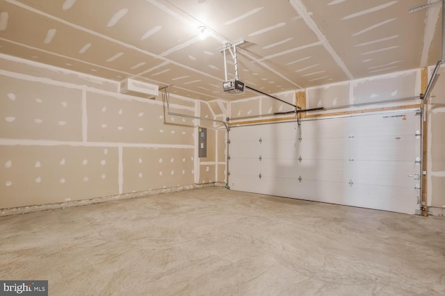 garage featuring a garage door opener and electric panel