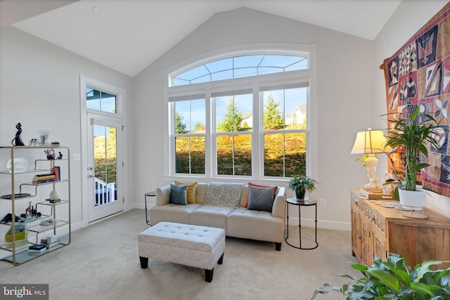 living room with light colored carpet and vaulted ceiling