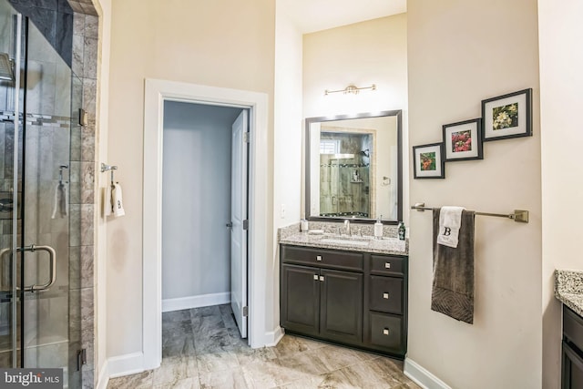 bathroom with vanity and an enclosed shower