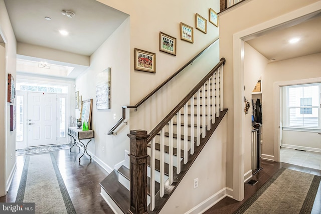 foyer entrance with dark hardwood / wood-style flooring