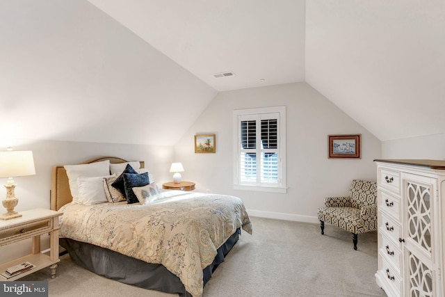 carpeted bedroom featuring lofted ceiling