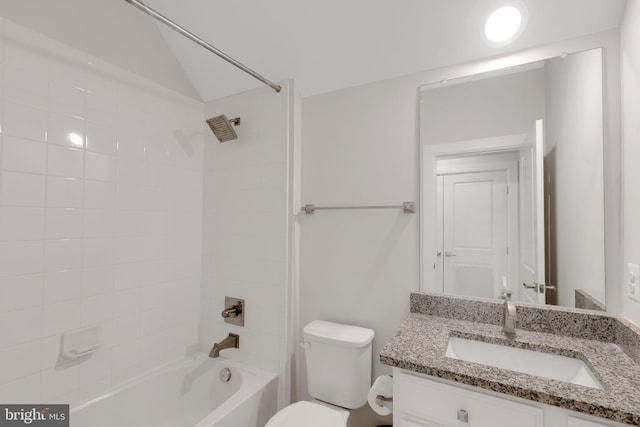 full bathroom with vanity, toilet, and tiled shower / bath