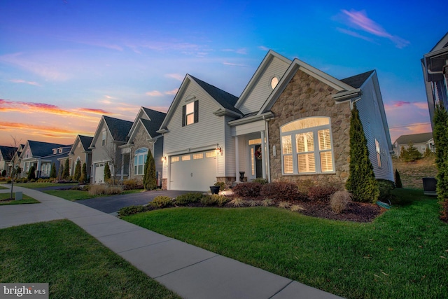 view of front of home with a lawn, central air condition unit, and a garage