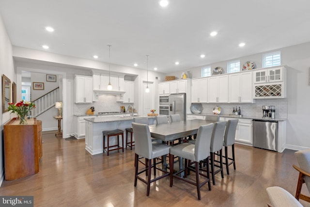 dining room featuring dark hardwood / wood-style flooring and sink