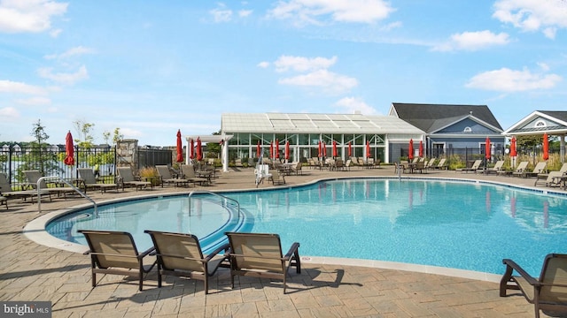 view of swimming pool with a patio area