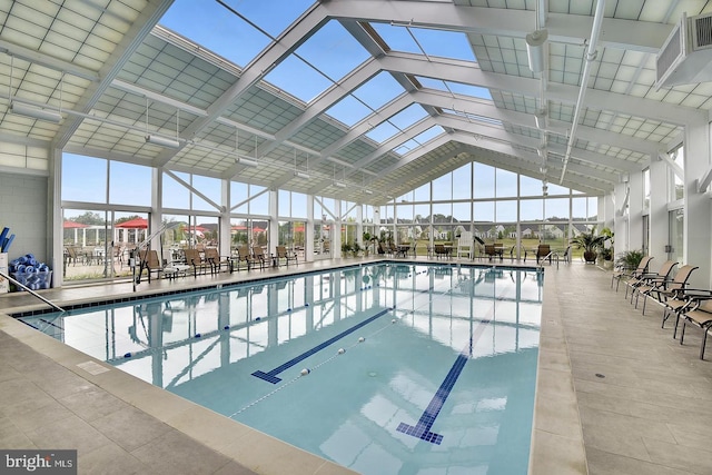 view of pool with glass enclosure