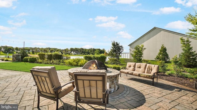 view of patio / terrace featuring an outdoor living space with a fire pit