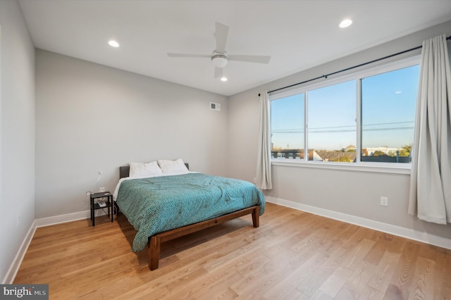 bedroom featuring light hardwood / wood-style floors and ceiling fan