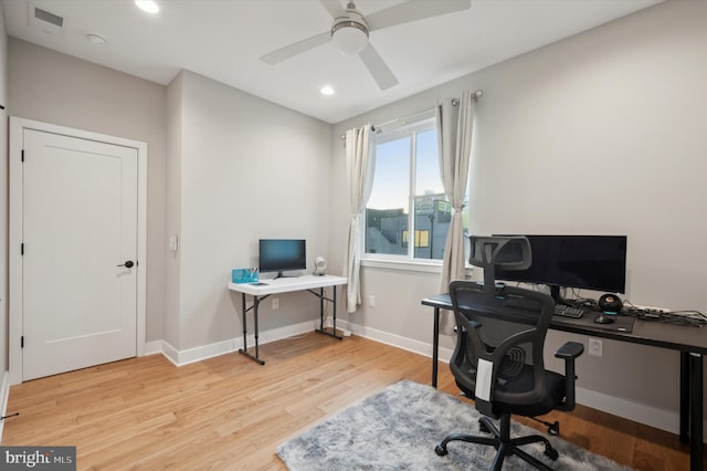 office space featuring light hardwood / wood-style flooring and ceiling fan