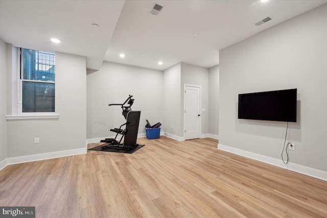 exercise area with light wood-type flooring