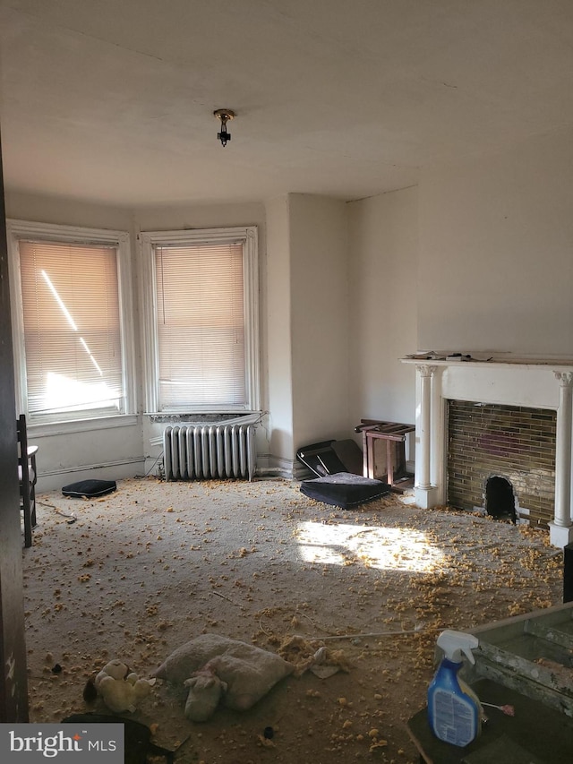 unfurnished living room featuring radiator