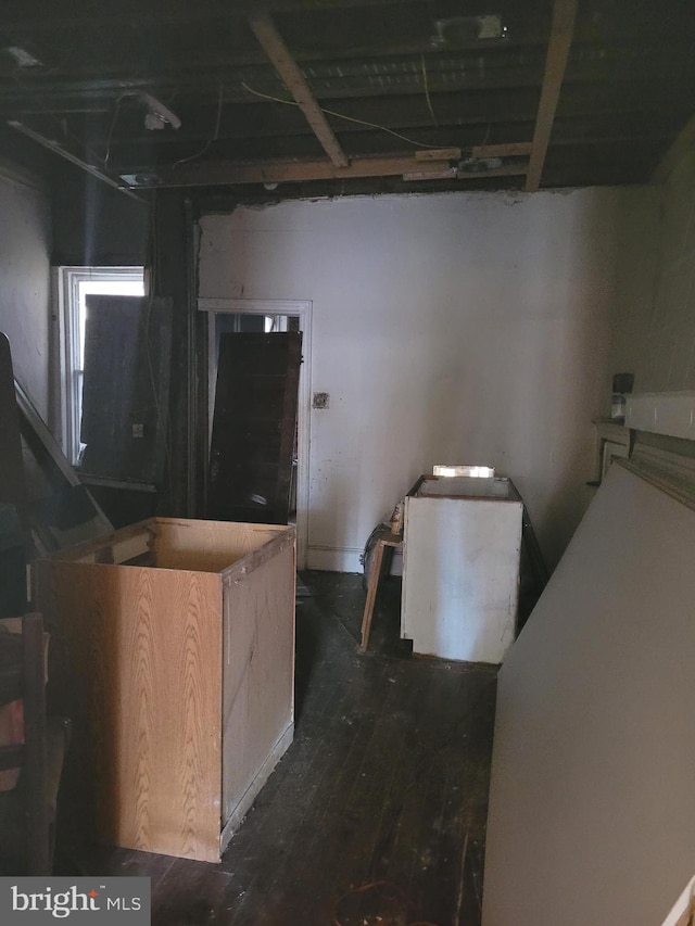 interior space with light brown cabinets and dark wood-type flooring