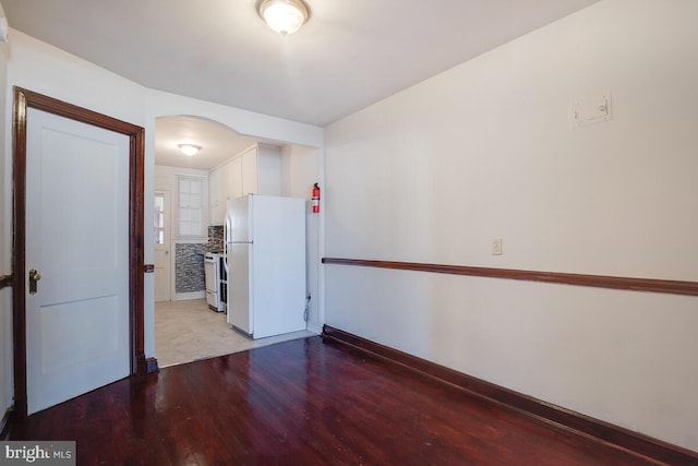 spare room with light hardwood / wood-style flooring