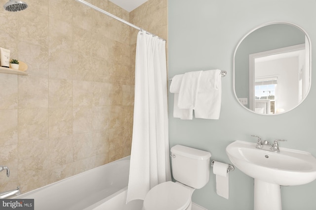 full bathroom featuring shower / tub combo, toilet, and sink