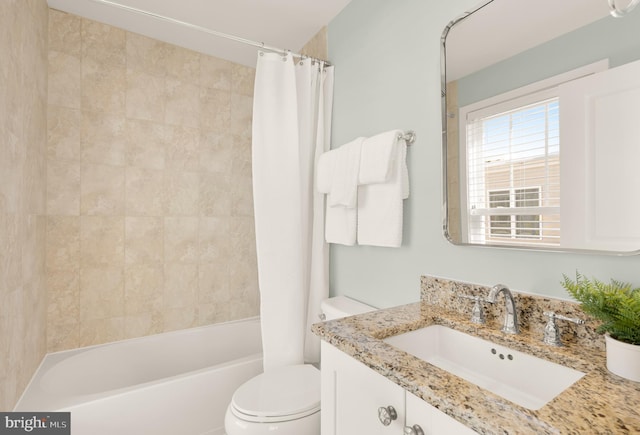 full bathroom with vanity, toilet, and shower / tub combo