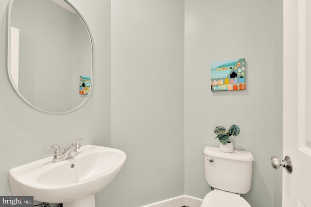 bathroom with toilet and sink