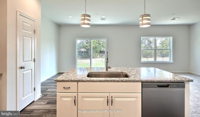 kitchen with a wealth of natural light, dishwasher, white cabinets, and sink