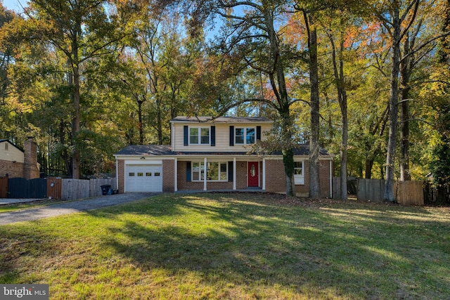 view of front property with a garage and a front lawn