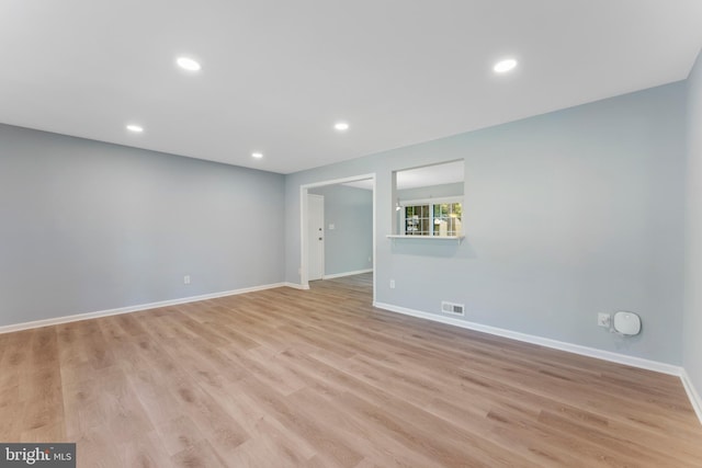 spare room featuring light hardwood / wood-style floors