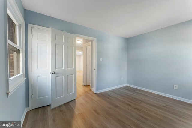 unfurnished bedroom featuring wood-type flooring