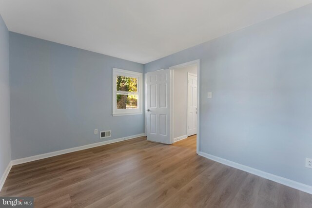 unfurnished room with light hardwood / wood-style floors