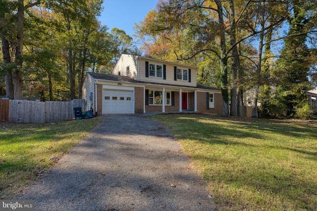 view of property featuring a front lawn and a garage