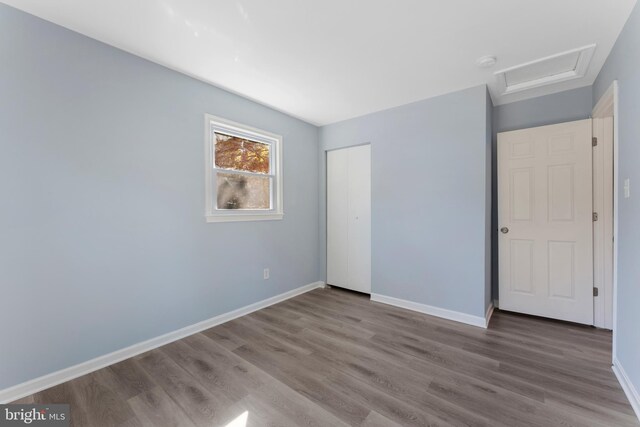 empty room with wood-type flooring