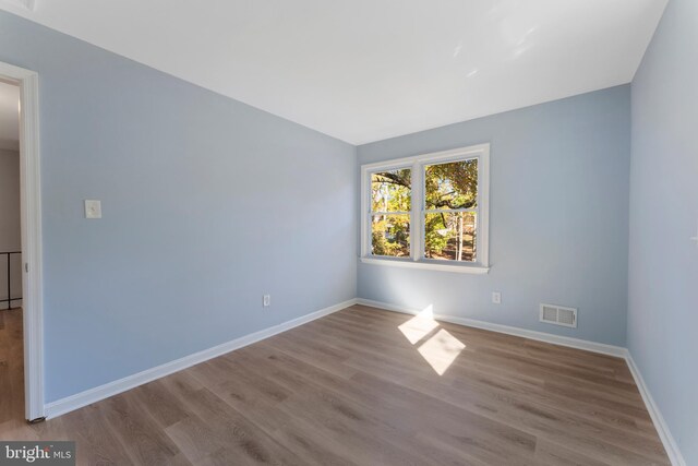 spare room with light wood-type flooring