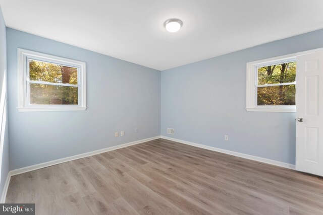 empty room with light wood-type flooring