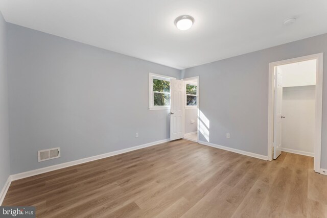 unfurnished room featuring light hardwood / wood-style floors