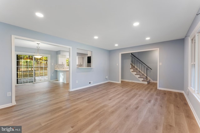 unfurnished living room featuring light hardwood / wood-style flooring