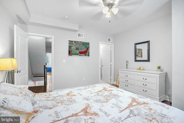 bedroom with ceiling fan and hardwood / wood-style flooring