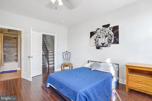 bedroom with dark wood-type flooring and ceiling fan