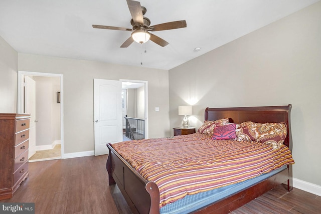 bedroom with dark wood-type flooring and ceiling fan