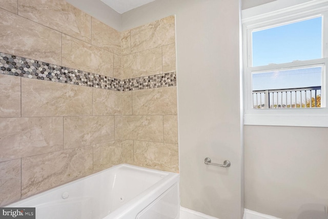 bathroom featuring a washtub