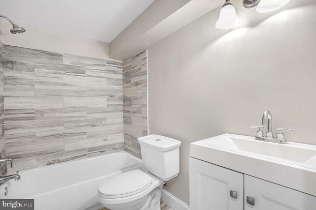 full bathroom featuring vanity, toilet, and tiled shower / bath combo