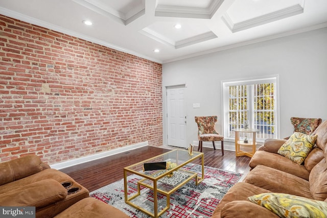 living room featuring coffered ceiling, crown molding, brick wall, and wood-type flooring