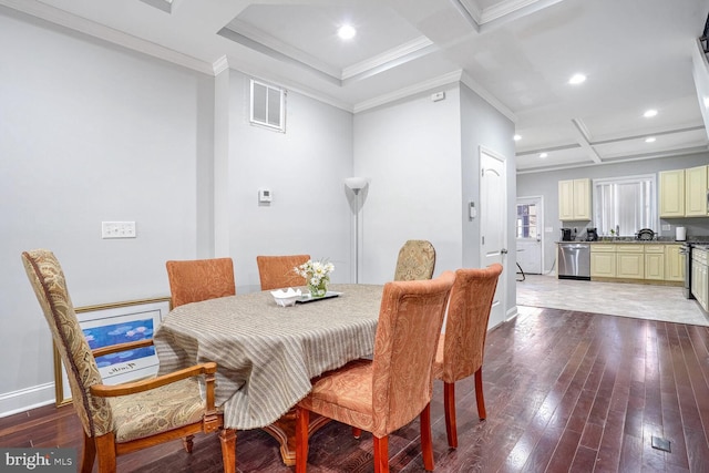 dining space with coffered ceiling, wood-type flooring, ornamental molding, and beamed ceiling