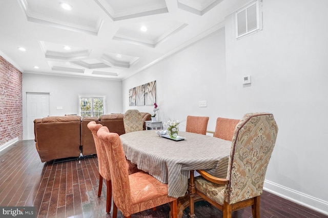 dining space with ornamental molding, dark hardwood / wood-style floors, beam ceiling, and coffered ceiling