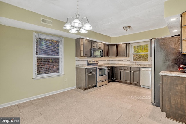 kitchen featuring hanging light fixtures, an inviting chandelier, light tile patterned flooring, dark brown cabinetry, and stainless steel appliances