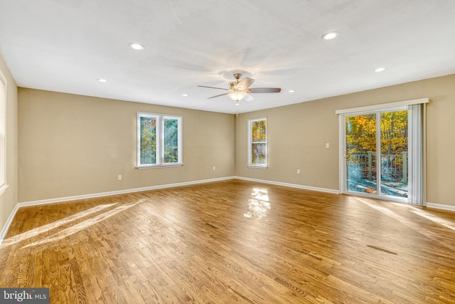 unfurnished room with ceiling fan and light wood-type flooring