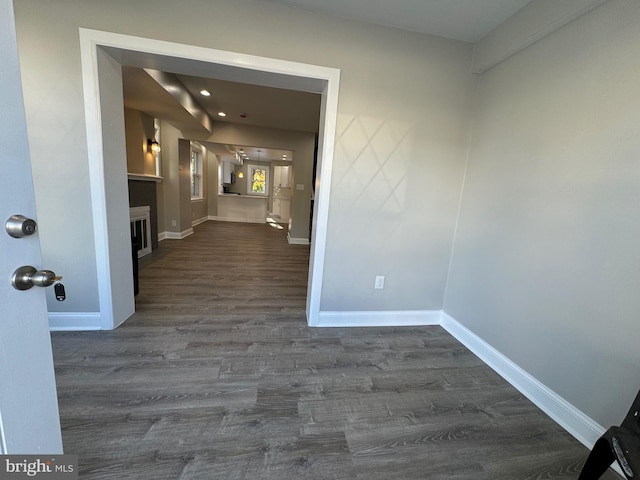 hallway with dark wood-type flooring