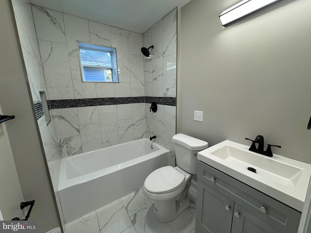 full bathroom featuring tiled shower / bath, vanity, and toilet